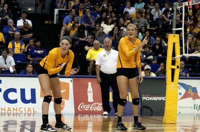 LSU freshmen Toni Rodriguez (25) and Olivia Beyer (8) communicate with the team Sunday, Sept. 13, 2015, during the Tigers' 3-1 loss to Miami in the PMAC.