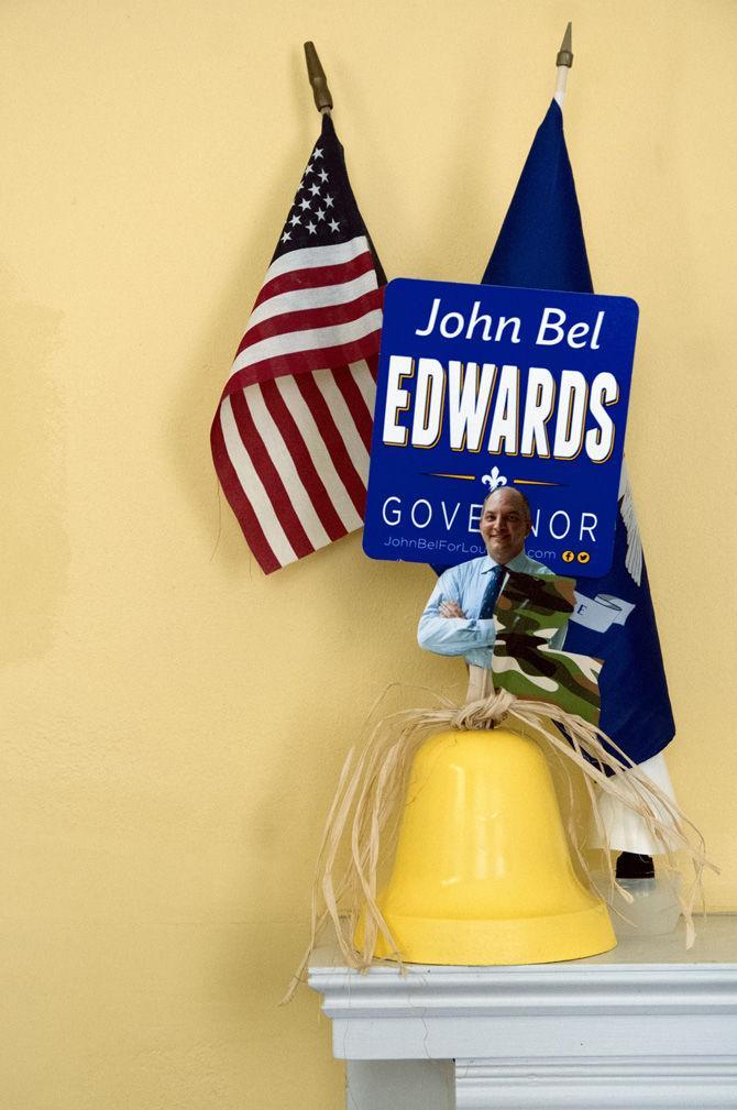 Flags, pictures and campaign signs line the walls of John Bel Edwards' campaign headquarters.