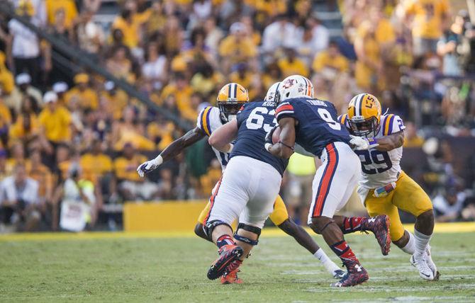 LSU junior safety Rickey Jefferson (29) tackles Auburn sophomore running back Roc Thomas (9) during the Tigers&#8217; 45-21 victory against Auburn on Saturday, Sept. 19, 2015 in Tiger Stadium.