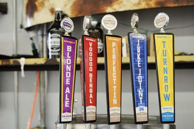 Tin Roof Brewing Company offers various custom beers on tap inside their tap room.