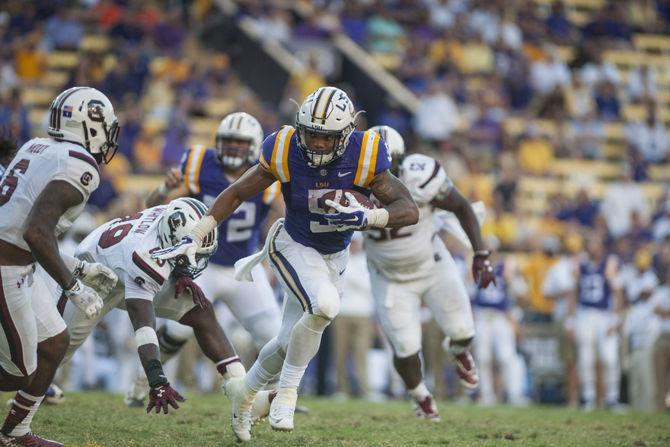 LSU freshman running back Derrius Guice (5) runs the ball during the Tigers&#8217; 45-24 victory against the University of South Carolina on Saturday, Oct. 10, 2015 in Tiger Stadium.