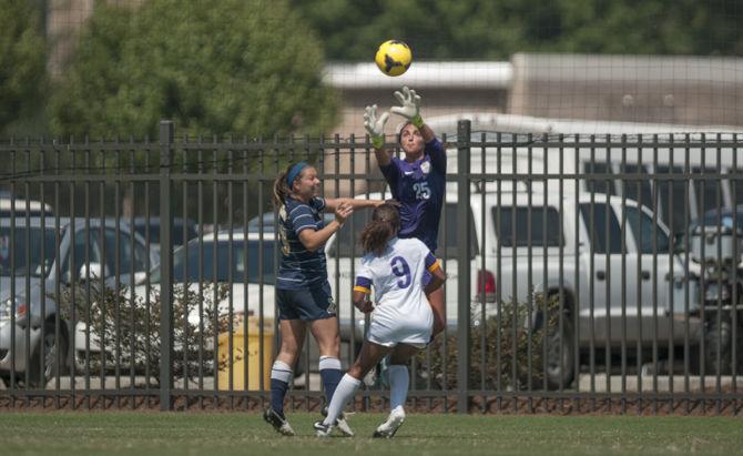 LSU senior goalkeeper Catalina Rubiano (25) jumps to grab the ball during the Tigers' 5-1 victory against Marquette on Sunday, Sept. 20, 2015 in the LSU Soccer Stadium.