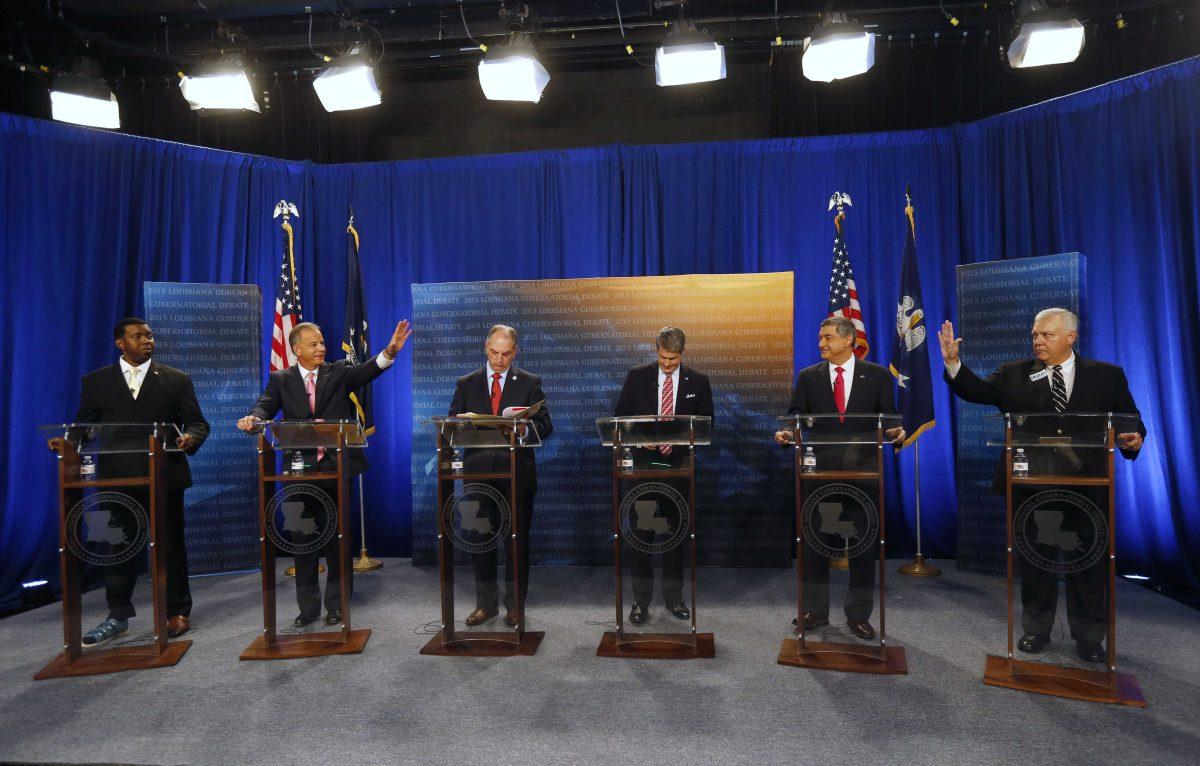 Gubernatorial candidates ready themselves for a debate, sponsored by WDSU, at their studio in New Orleans, Thursday, Oct. 1, 2015. From left are: Rev. Jeremy Odom, Louisiana Public Service Commissioner Dist. 2., Scott Angelle, state Rep. John Bel Edwards, D-Baton Rouge, Sen. David Vitter, R-La., Lt. Gov. Jay Dardenne, and attorney Cary Deaton. (AP Photo/Gerald Herbert)