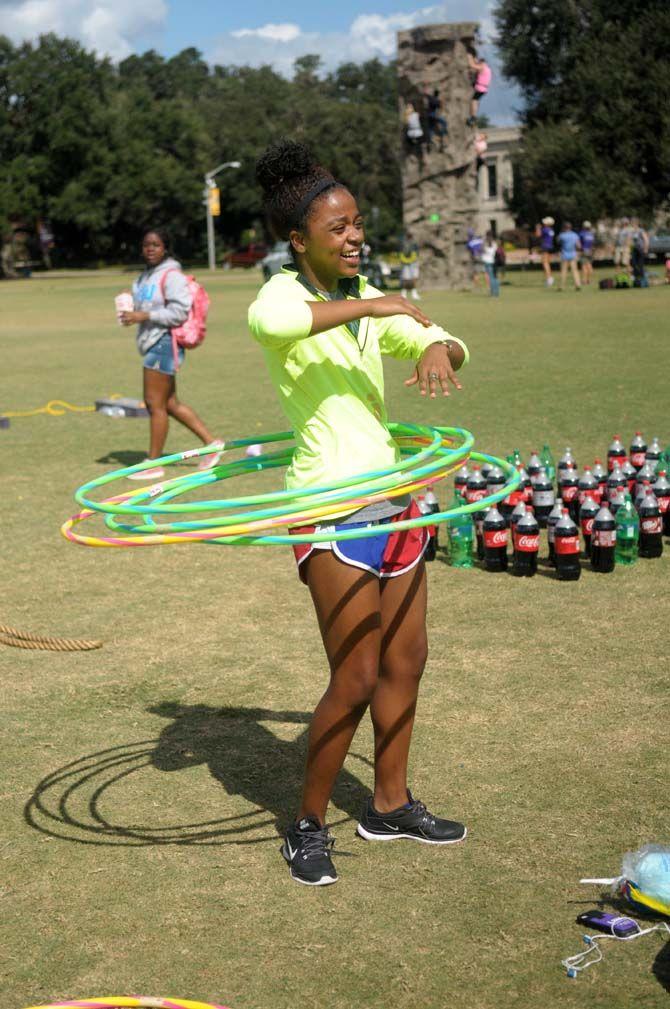 Students playing with hula hoops at LSU Homecoming Week field day event Wednesday October 21, 2015 on the parade grounds.