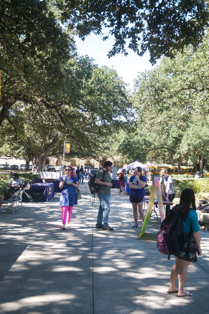 LSU students walk past different organizations set up on Thursday, Oct. 15, 2015 in Free Speech Alley.