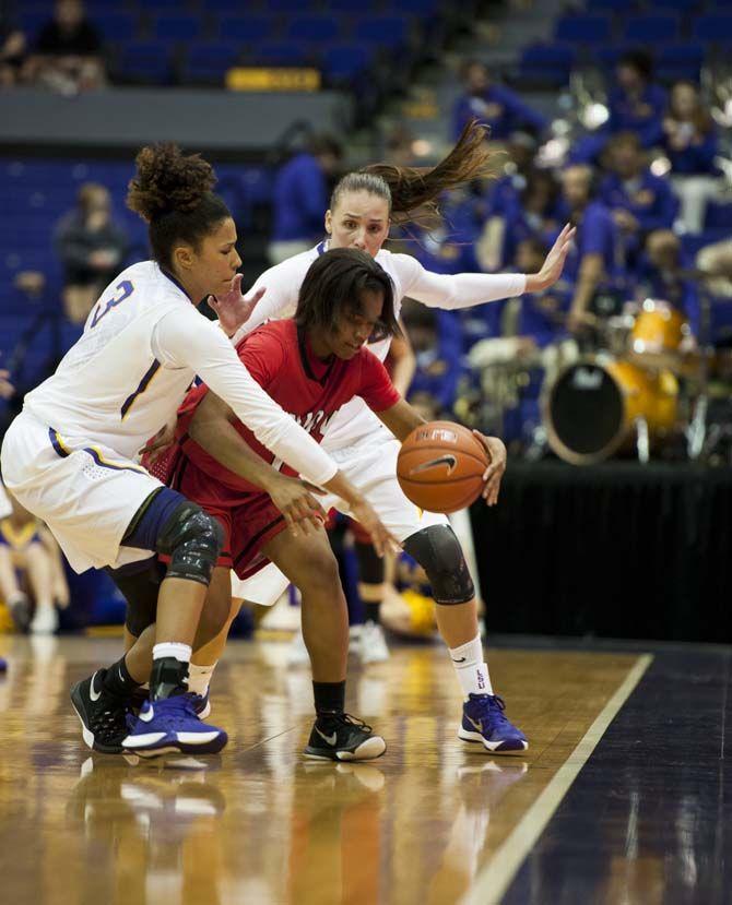 LSU senior forward Akilah Bethel (3) (left) and senior forward/guard Anne Pedersen (4) keep Union freshman guard Jada Perkins (1) on the edge of the court during their 88-57 win against Union on Wednesday Nov. 4, 2015, in the LSU Pete Maravich Assembly Center.