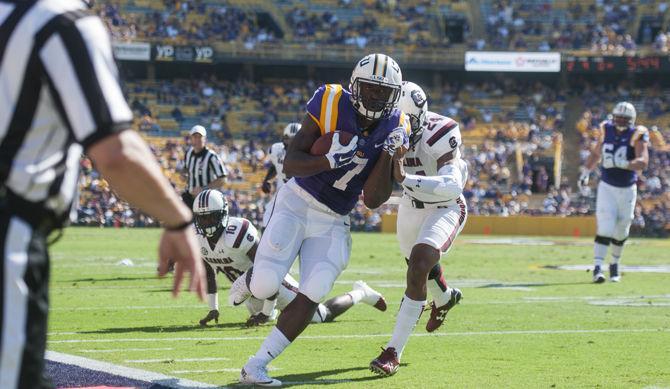 LSU sophomore running back Leonard Fournette is pushed out of bounds by University of South Carolina sophomore free safety D.J. Smith (24) during the Tigers&#8217; 45-24 victory on Saturday, Oct. 10, 2015 in Tiger Stadium.