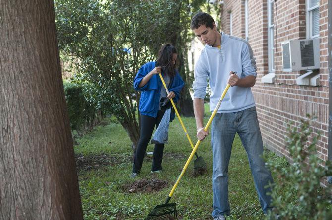 Students from Volunteer LSU helped out by raking leaves, sorting clothing, and wiping down tables on Nov. 15, 2015 around the Iris Domestic Violence Center in Baton Rouge.