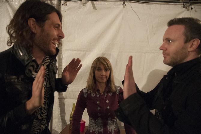 Joy Formidable's Justin Stahley, Ritzy Brian, and Rhydian Dafydd goof off after their show during the Voodoo Music and Arts festival on Oct. 31, 2015, in New Orleans City Park.