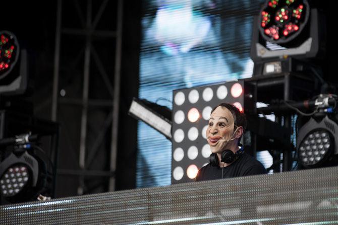 Herb Christopher wears a mask during the Voodoo music and arts experience on Oct. 31, 2015, in New Orleans City Park.