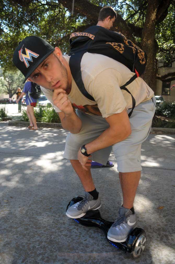 Communication studies senior Keith Hornsby on his self-balancing scooter.