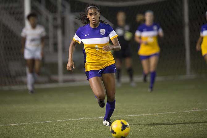 LSU junior forward Summer Clarke (4) chases the ball after it being cleared by a teammate during the LSU vs Vanderbilt University game on Friday Oct. 2, 2015, at the LSU Soccer Stadium.