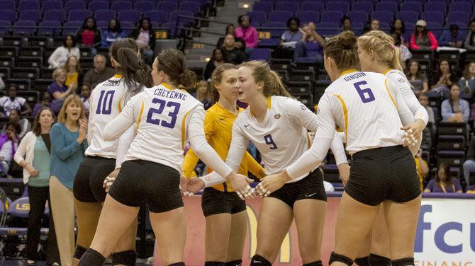 The LSU volleyball team celebrates a point on Sunday, Nov. 8, 2015 during the Tigers' 3-set match loss against the University of Missouri in the PMAC.