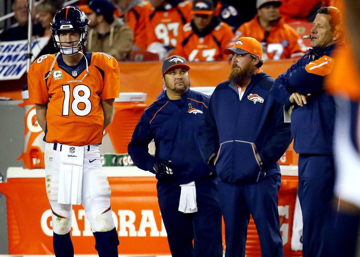 Denver Broncos quarterback Peyton Manning (18) watches from the sidelines during the second half of an NFL football game against the Kansas City Chiefs, Sunday, Nov. 15, 2015, in Denver. (AP Photo/Joe Mahoney)