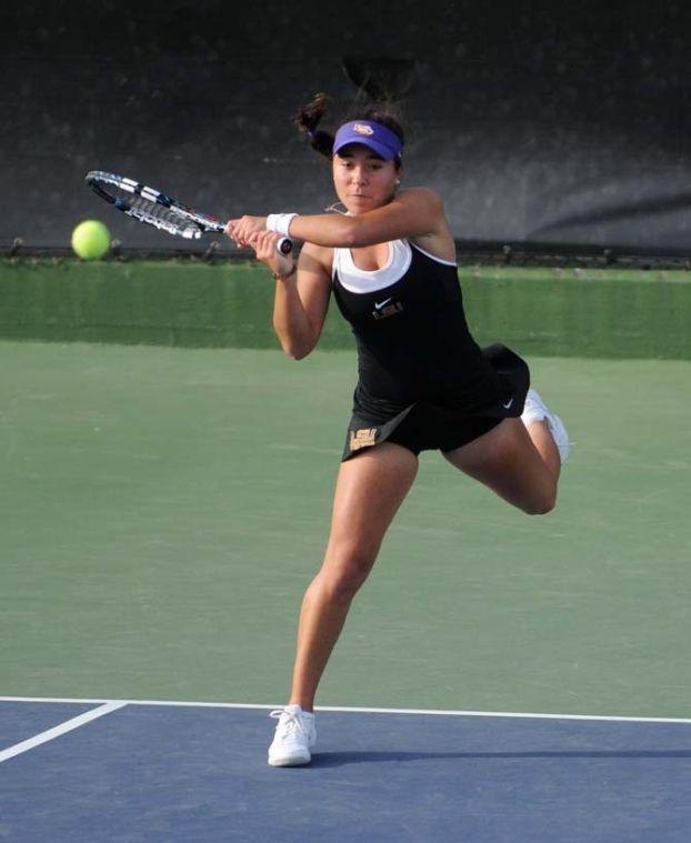 LSU freshman Joana Vale Costa hits the ball Friday, March 21, 2014 during a doubles match against Mississippi State at W.T. "Dub" Robinson Stadium.