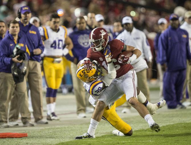 LSU senior saftey Jalen Mills (28) tackles Alabama senior wide receiver ArDarius Stewart (16) during the Tigers' 30-16 defeat against the Crimson Tide on Saturday, Nov. 7, 2015 in the Bryant-Denny Stadium.