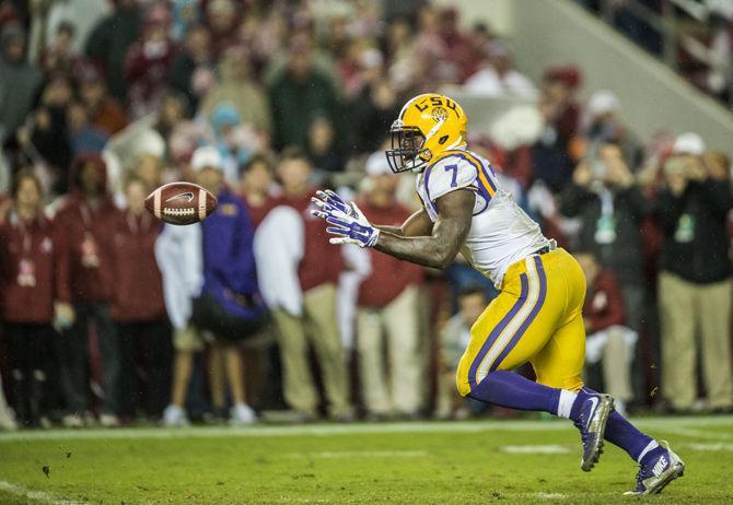 LSU sophomore running back Leonard Fournette (7) catches the ball after the snap that led to a touchdown during the Tigers' 30-16 defeat against The University of Alabama on Saturday, Nov. 7, 2015 in the Bryant-Denny Stadium.