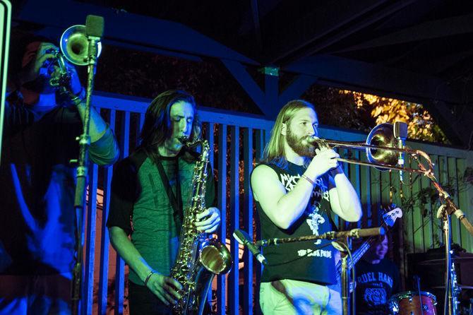 Garrett Corripo, Justin Mcdowell, and Josh Bourgeois make up Joystick's brass section during the Battle of the Bands on Nov. 5, 2015, at Barcadia.