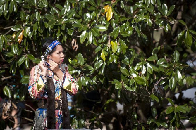 Coushatta tribe member and jingle dress dancer Traci Ahshapanek adorns herself in traditional regalia on Wednesday, Nov. 18, 2015 before the Native American Student Association's dance exhibition in Free Speech Plaza.