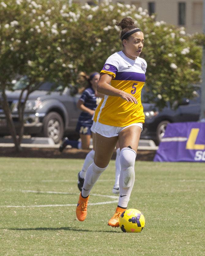 LSU sophomore forward Jorian Baucom dribbles the ball down the field on Sunday, Sept. 20, 2015 during the Tigers&#8217; 5-1 win at LSU Soccer Stadium.