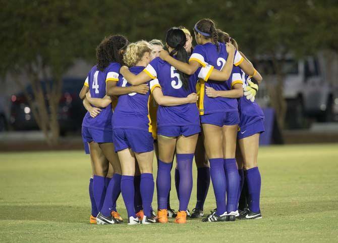 LSU starters huddle up before the first half of the game on Friday Oct. 2, 2015, at the LSU Soccer Stadium.