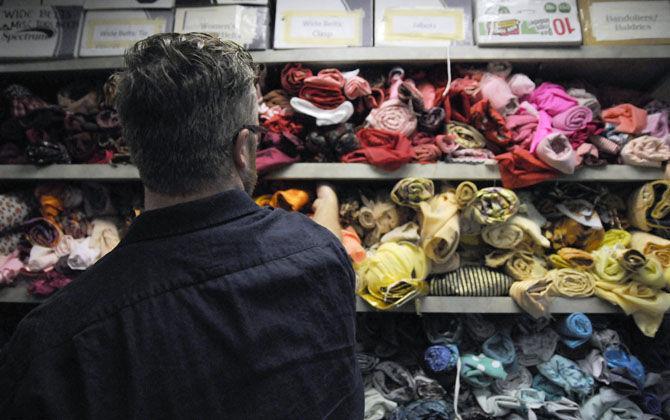 LSU Assistant Professor of Costume Design Brandon R. McWilliams pulls out accessories for a costume for the upcoming play on Friday, Sept. 11, 2015 in the Costume Shop of the Music and Dramatic Arts Building.