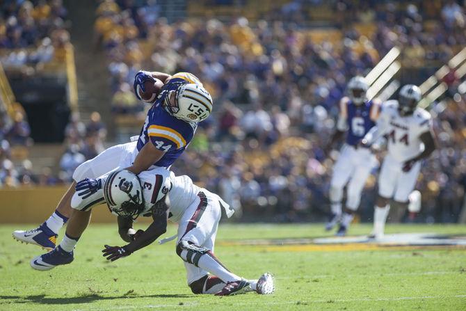 <p>LSU sophomore fullback John David Moore (44) is hit by University of South Carolina sophomore cornerback Chris Lammons (3) during the Tigers’ 45-24 victory on Saturday, Oct. 10, 2015 in Tiger Stadium.</p>