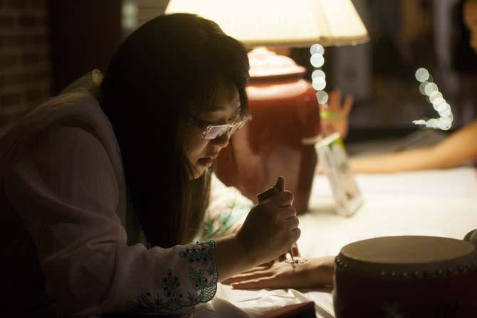 A henna tattoo booth set up at the entrance of the center for family and students to get traditional henna tattoos at the Asian American Cultural Showcase, presented by the Asian American Abassadors on Friday Nov. 13, 2015, at the International Cultural Center at LSU.