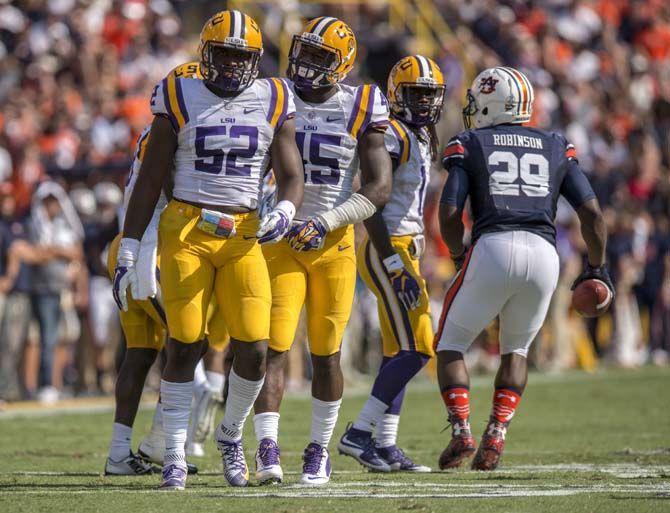 <p>LSU senior linebacker Deion Jones (45) congratulates junior linebacker Kendell Backwith (52) after a tackle during the Tigers' 45-21 victory against Auburn on Saturday, Sept.19, 2015, in Tiger Stadium.</p>