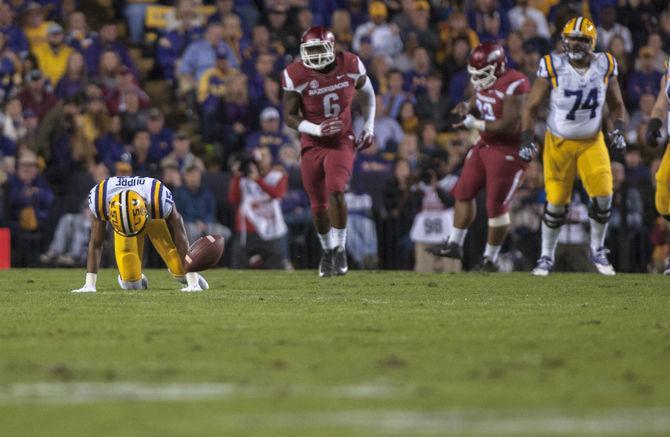 LSU sophomore wide receiver Malachi Dupre (15) fumbles the ball during the first quarter against the University of Arkansas on Nov. 14. 2015 in Tiger Stadium.