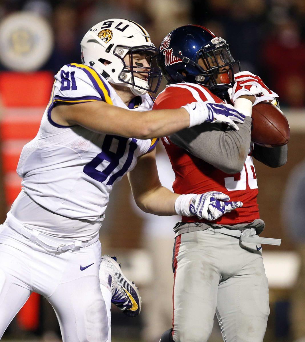 Mississippi defensive back Mike Hilton (38) intercepts for a pass intended for LSU tight end Colin Jeter (81) in the second half of an NCAA college football game in Oxford, Miss., Saturday, Nov. 21, 2015. Mississippi won 38-17. (AP Photo/Rogelio V. Solis)