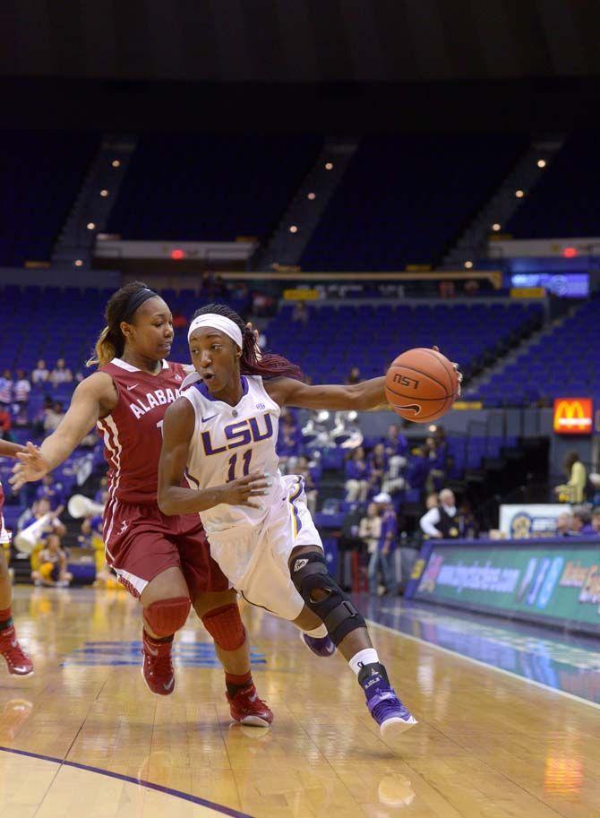 LSU sophomore guard, Raigyne Moncrief (11), dribbles the ball during the Tigers' 51-39 victory against Alabama on Sunday, Feb. 8, 2015, in the Pete Maravich Assembly Center.