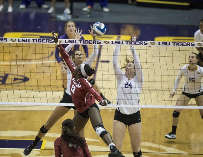 LSU senior middle blocker Emily Ehrle (2) and senior outside hitter Cati Leak (24) block the ball during the Tigers' 3-2 defeat against The University of Alabama on Sunday Oct. 18, 2015, in the Pete Maravich Assembly Center.