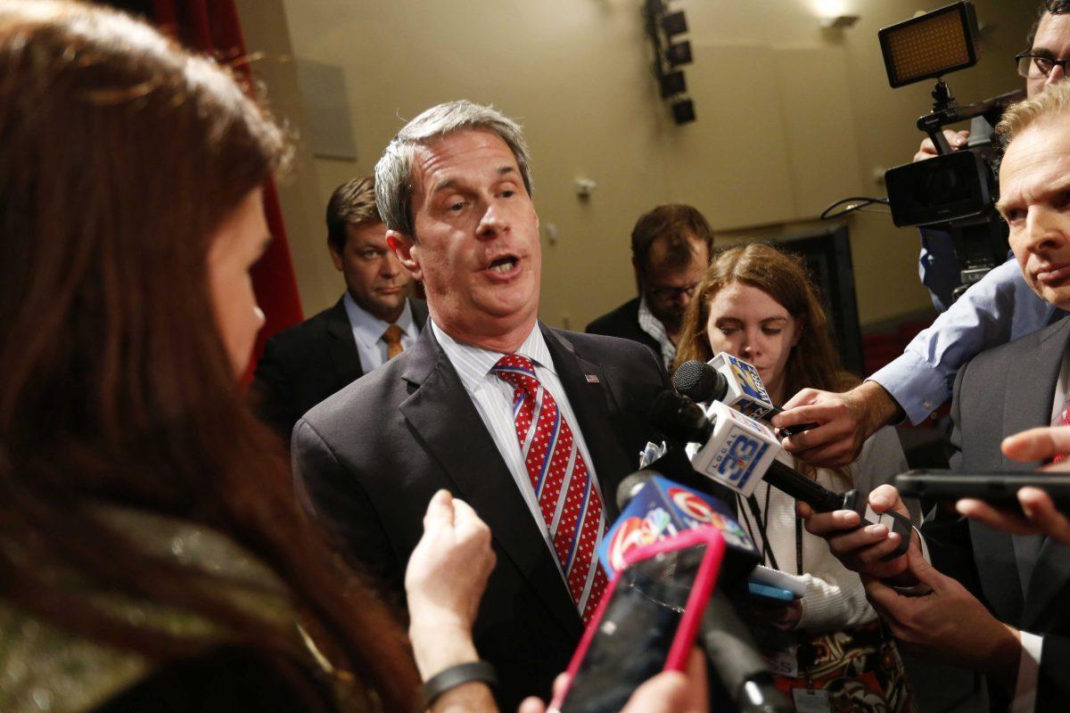 Louisiana gubernatorial candidate, Sen. David Vitter, R-La., center, speaks to reporters after his debate against Democratic candidate John Bel Edwards, in Baton Rouge, La., Monday, Nov. 16, 2015. (AP Photo/Gerald Herbert)