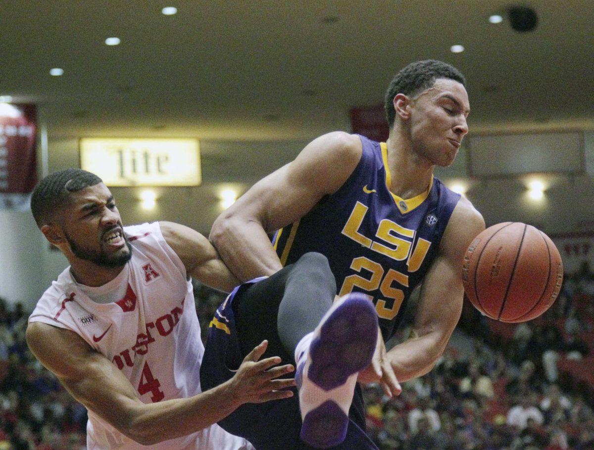 LSU forward Ben Simmons (25) gets the ball from Houston guard LeRon Barnes (4) during the second half of an NCAA college basketball game at Hofheinz Pavillion Sunday, Dec. 13, 2015, in Houston. (Jon Shapley/Houston Chronicle via AP) MANDATORY CREDIT