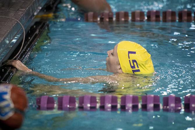 LSU marketing senior Megan Cox catches her breath after competing in the Women's 100 Yard Freestyle event on Saturday, Nov. 7, 2015, during the Tigers' 197-103 win against Southern Methodist University in the Natatorium.