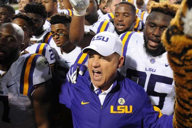 LSU Head Coach, Les Miles, celebrates with the team after the Tigers win 21-19 against Mississippi State on Saturday, at Davis Wade Stadium.