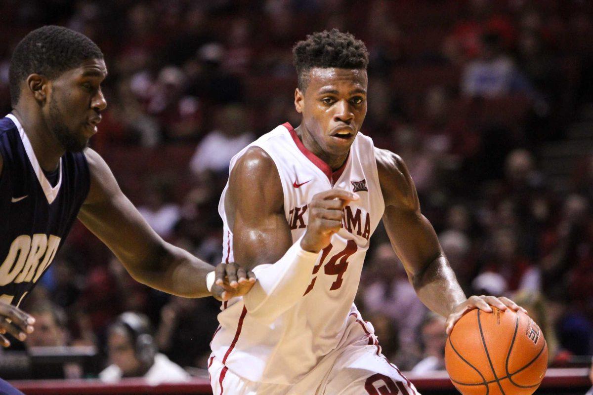 Senior guard Buddy Hield pushes past an Oral Roberts defender for two points Dec. 12.&#160;