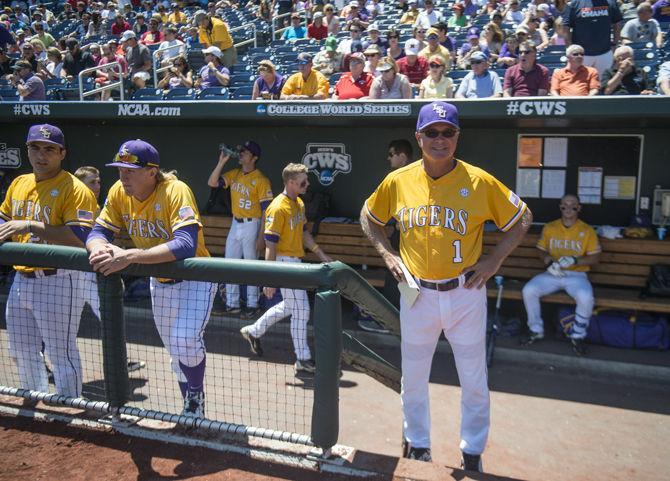 LSU head coach Paul Mainieri stands inside the dugout before the the Tigers' 5-3 victory against Cal State Fullerton in the NCAA Men's College World Series on Tuesday, June 16, 2015 at the TD Ameritrade Park in Omaha.