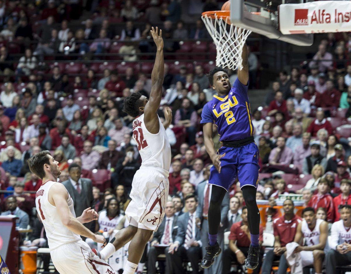 LSU guard Antonio Blakeney scores two past Alabama guard Retin Obasohan (32) during an NCAA college basketball game, Saturday, Jan. 23, 2016, at Coleman Coliseum in Tuscaloosa, Ala. (Vasha Hunt/AL.com via AP) MAGS OUT; MANDATORY CREDIT