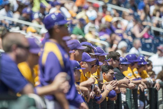 LSU baseball players watch the begining of the game during the Tigers' 5-3 victory against Cal State Fullerton in the NCAA Men's College World Series on Tuesday, June 16, 2015 at the TD Ameritrade Park in Omaha.