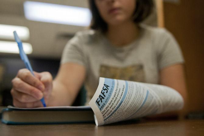 A student fills out the Free Application for Federal Aid (FAFSA) form on Tuesday, Sept. 1, 2015, in Hodges Hall.