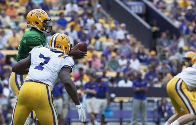 LSU sophomore quarterback Brandon Harris (6) passes the ball to sophomre runningback Leonard Fournette (7) during LSU white squad's 45-6 victory over LSU purple squad during the annual Spring Football game on Saturday, April 18, 2015 in Tiger Stadium.