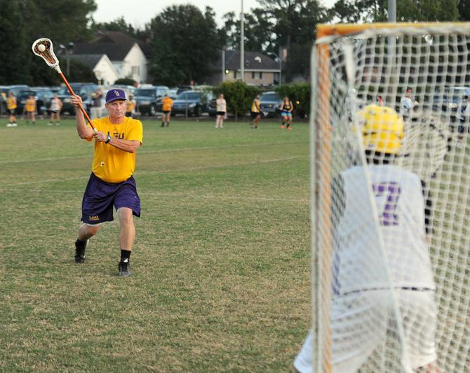 Lacrosse Coach Jeff Echols participates in practice Monday, Oct. 14, 2013 during Lacrosse practice at the UREC fields.