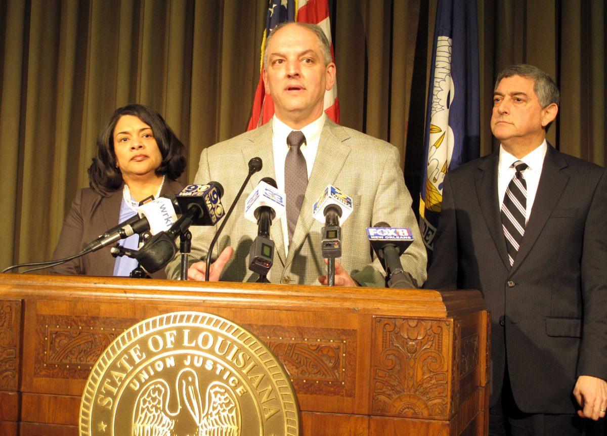 Louisiana Gov. John Bel Edwards, center, unveils his proposals for balancing Louisiana's budget, including a list of tax increases for legislative consideration, during a news conference, Tuesday, Jan. 19, 2016, in Baton Rouge, La. Joining Edwards are Revenue Secretary Kimberly Robinson, left, and Commissioner of Administration Jay Dardenne. (AP Photo/Melinda Deslatte)