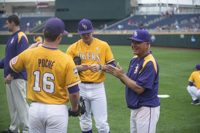 LSU head coach Paul Mainieri talks to sophomoe pitcher Jared Poch&#233; (16) and freshman pitcher Alex Lange (35) during LSU&#8217;s first practice in the NCAA Men's College World Series on Friday, June 12, 2015 at the TD Ameritrade Park in Omaha.