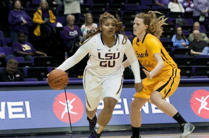 LSU junior forward Alexis Hyder (20) dribbles past Long Beach State University junior forward Madison Montgomery (22) on Saturday, Nov. 21, 2015 during the Tigers' 59-53 over LBSU in the PMAC.