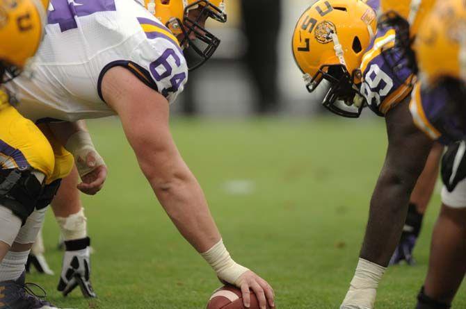 LSU freshman offensive lineman William Clapp (64) snaps the ball during LSU white squad's 45-6 victory over LSU purple squad during the annual Spring Football game on Saturday, April 18, 2015 in Tiger Stadium.