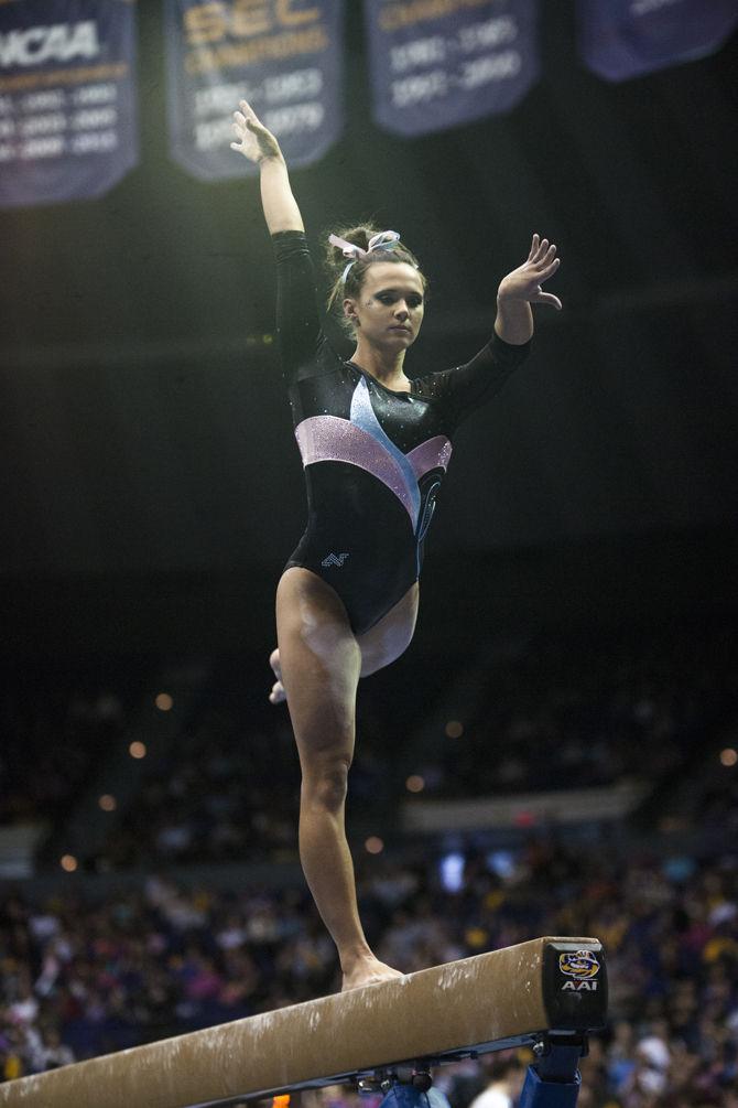 LSU all-around junior Ashleigh Gnat performs a beam routine during the Tigers' 196.575-195.100 victory against Kentucky for the Pink &amp; Blue Meet on Friday, Jan. 22, 2016 in the PMAC.