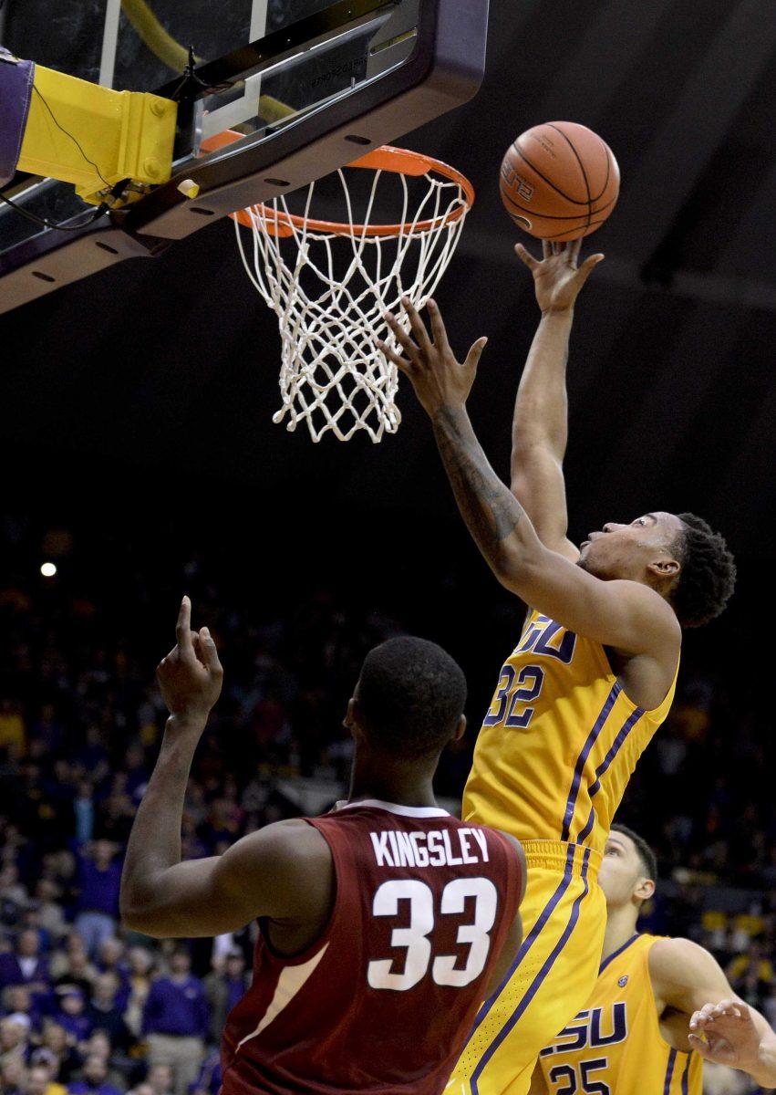 LSU forward Craig Victor II (32) scores the game-winning basket against Arkansas during an NCAA college basketball game in Baton Rouge, La., Saturday, Jan. 16, 2016. (Hilary Scheinuk/The Advocate via AP) MAGS OUT; INTERNET OUT; NO SALES; TV OUT; NO FORNS; LOUISIANA BUSINESS INC. OUT (INCLUDING GREATER BATON ROUGE BUSINESS REPORT, 225, 10/12, INREGISTER, LBI CUSTOM); MANDATORY CREDIT